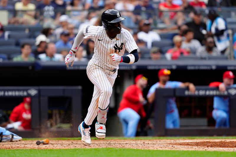 Aug 31, 2024; Bronx, New York, USA; New York Yankees third baseman Jazz Chisholm Jr. (13) runs out an infield single against the St. Louis Cardinals during the eighth inning at Yankee Stadium. Mandatory Credit: Gregory Fisher-USA TODAY Sports