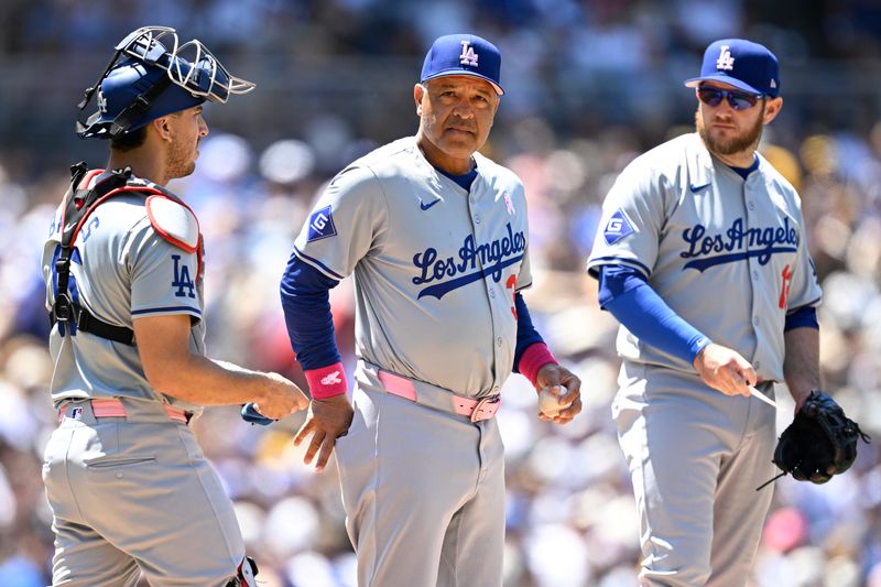 May 12, 2024; San Diego, California, USA; Los Angeles Dodgers manager Dave Roberts (30) looks on during a pitching change in the fourth inning against the San Diego Padres at Petco Park. Mandatory Credit: Orlando Ramirez-USA TODAY Sports