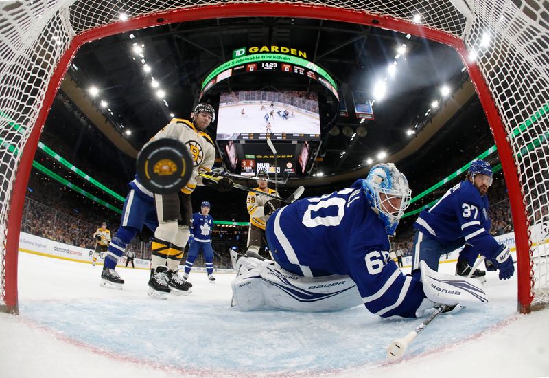 Mar 7, 2024; Boston, Massachusetts, USA; Toronto Maple Leafs goaltender Joseph Woll (60) looks back to see a sahot by Boston Bruins right wing David Pastrnak (88) go in the net for a goal during the first period at TD Garden. Mandatory Credit: Winslow Townson-USA TODAY Sports