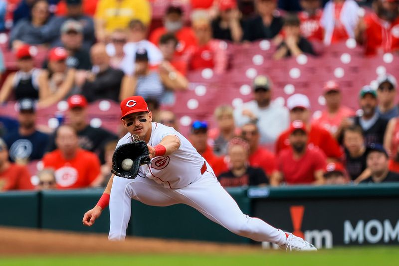 May 9, 2024; Cincinnati, Ohio, USA; Cincinnati Reds first baseman Spencer Steer (7) tags first to get Arizona Diamondbacks catcher Tucker Barnhart (not pictured) out in the second inning at Great American Ball Park. Mandatory Credit: Katie Stratman-USA TODAY Sports