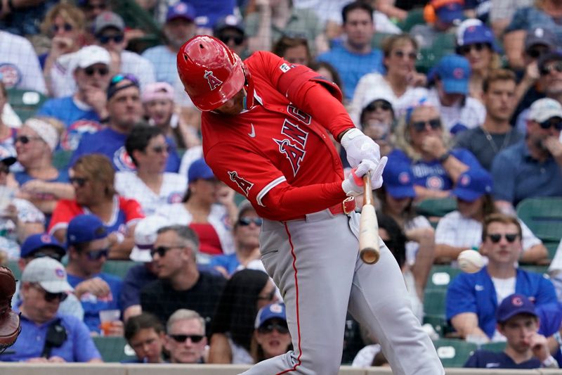 Jul 5, 2024; Chicago, Illinois, USA; Los Angeles Angels outfielder Taylor Ward (3) hits a one run single against the Chicago Cubs during the fifth inning at Wrigley Field. Mandatory Credit: David Banks-USA TODAY Sports