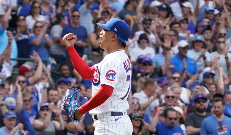 Aug 19, 2023; Chicago, Illinois, USA; Chicago Cubs relief pitcher Adbert Alzolay (73) reacts after getting the final out against the Kansas City Royals during the ninth inning at Wrigley Field. Mandatory Credit: David Banks-USA TODAY Sports