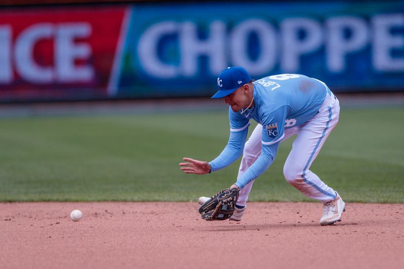 Apr 16, 2023; Kansas City, Missouri, USA; Kansas City Royals shortstop Nicky Lopez (8) goes after a ground ball during the sixth inning against the Atlanta Braves at Kauffman Stadium. Mandatory Credit: William Purnell-USA TODAY Sports