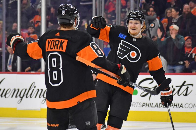 Mar 19, 2024; Philadelphia, Pennsylvania, USA; Philadelphia Flyers right wing Owen Tippett (74) celebrates his goal with defenseman Cam York (8) against the Toronto Maple Leafs during the first period at Wells Fargo Center. Mandatory Credit: Eric Hartline-USA TODAY Sports