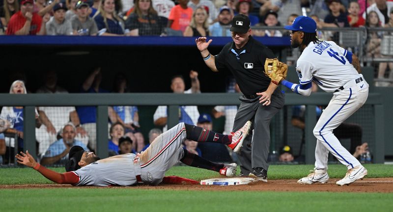 Jul 29, 2023; Kansas City, Missouri, USA;  Minnesota Twins center fielder Willi Castro (50) is tagged out at third base by Kansas City Royals third baseman Maikel Garcia (11) during the eighth inning at Kauffman Stadium. Mandatory Credit: Peter Aiken-USA TODAY Sports