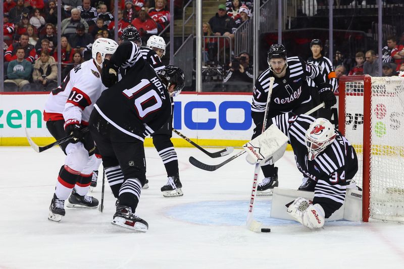 Mar 23, 2024; Newark, New Jersey, USA; New Jersey Devils goaltender Jake Allen (34) makes a save against the Ottawa Senators during the first period at Prudential Center. Mandatory Credit: Ed Mulholland-USA TODAY Sports
