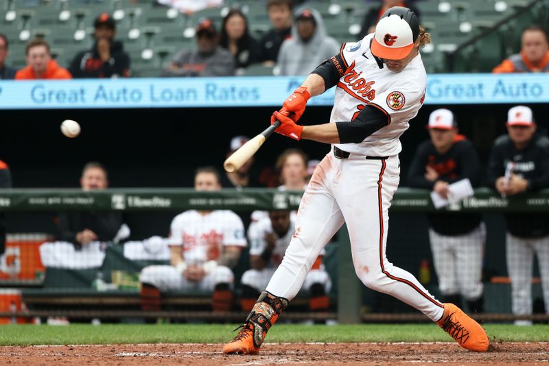 May 14, 2025; Baltimore, Maryland, USA; Baltimore Orioles shortstop Gunnar Henderson (2) hits a single during the seventh inning against the Minnesota Twins at Oriole Park at Camden Yards. Mandatory Credit: Daniel Kucin Jr.-Imagn Images