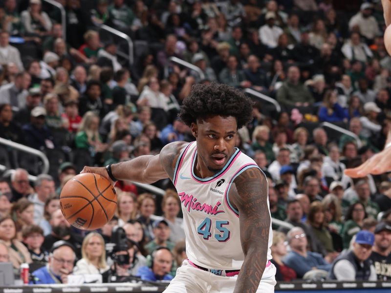 MILWAUKEE, WI - FEBRUARY 23: Davion Mitchell #45 of the Miami Heat drives to the basket during the game against the Milwaukee Bucks  on February 23, 2025 at Fiserv Forum Center in Milwaukee, Wisconsin. NOTE TO USER: User expressly acknowledges and agrees that, by downloading and or using this Photograph, user is consenting to the terms and conditions of the Getty Images License Agreement. Mandatory Copyright Notice: Copyright 2025 NBAE (Photo by Gary Dineen/NBAE via Getty Images).
