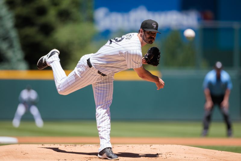 Jun 5, 2024; Denver, Colorado, USA; Colorado Rockies starting pitcher Dakota Hudson (32) delivers a pitch against the Cincinnati Reds during the first inning at Coors Field. Mandatory Credit: Andrew Wevers-USA TODAY Sports