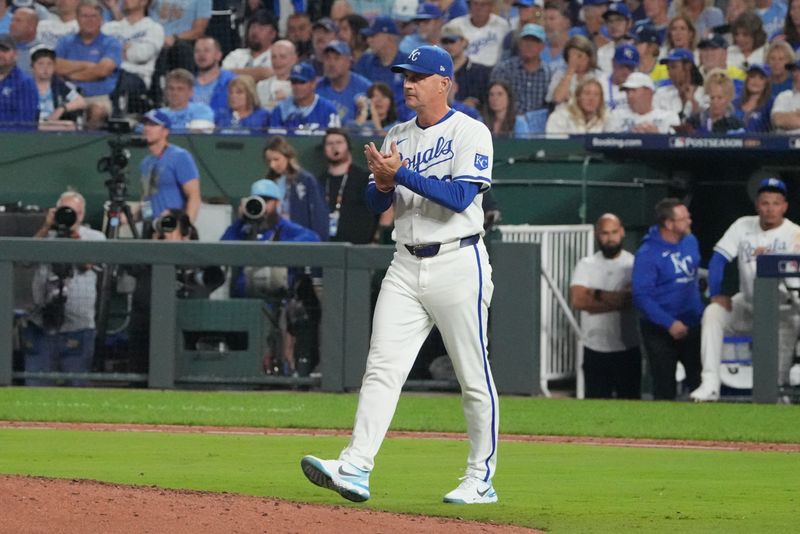 Oct 10, 2024; Kansas City, Missouri, USA; Kansas City Royals pitching coach Brian Sweeney (85) walks onto the field during the eighth inning against the New York Yankees during game four of the ALDS for the 2024 MLB Playoffs at Kauffman Stadium. Mandatory Credit: Denny Medley-Imagn Images