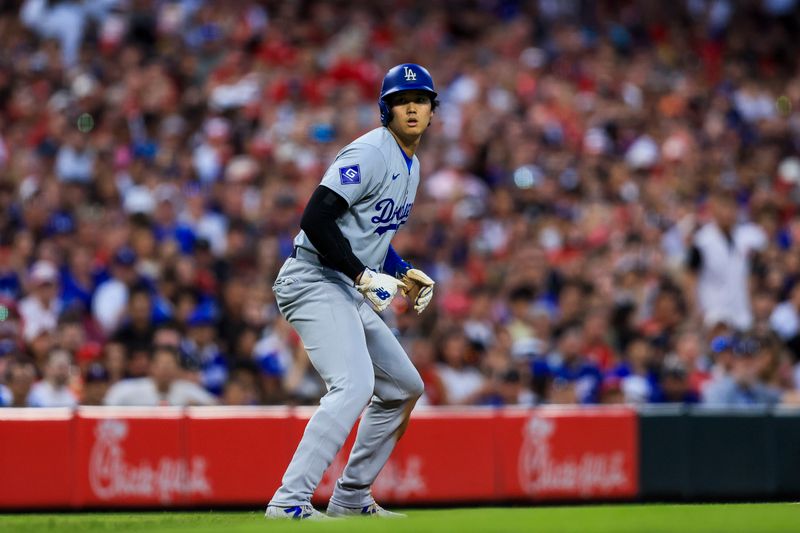 May 25, 2024; Cincinnati, Ohio, USA; Los Angeles Dodgers designated hitter Shohei Ohtani (17) leads off from third in the sixth inning against the Cincinnati Reds at Great American Ball Park. Mandatory Credit: Katie Stratman-USA TODAY Sports