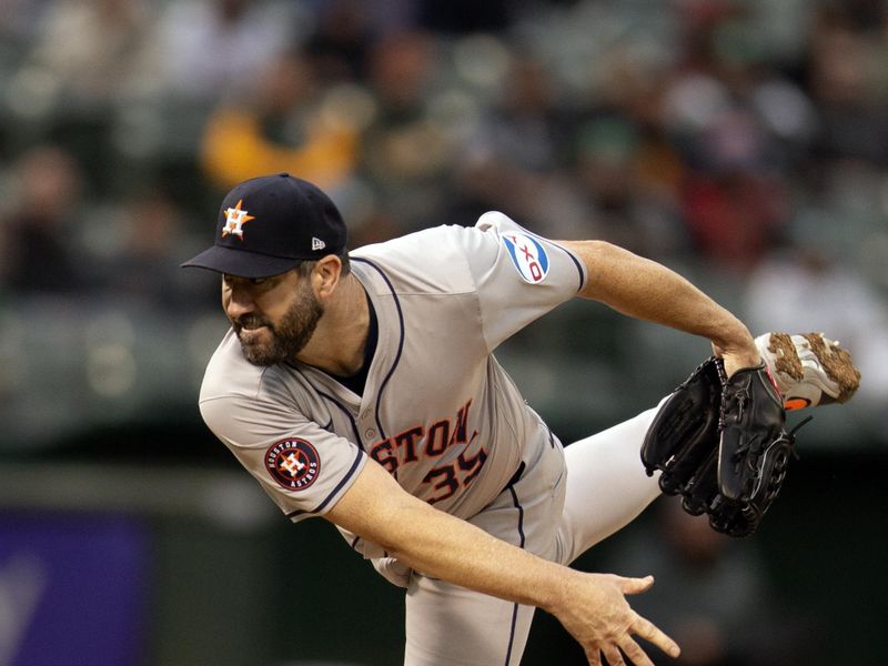 May 24, 2024; Oakland, California, USA; Houston Astros starting pitcher Justin Verlander (35) delivers a pitch against the Oakland Athletics during the third inning at Oakland-Alameda County Coliseum. Mandatory Credit: D. Ross Cameron-USA TODAY Sports