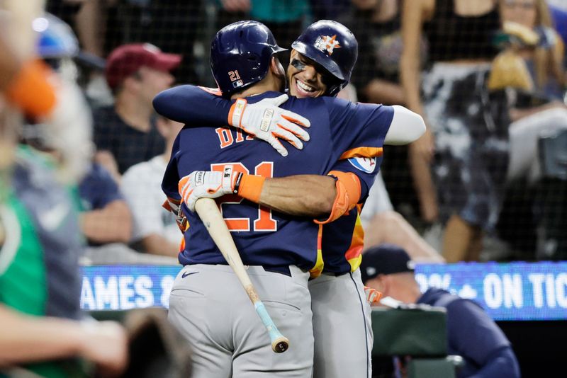 Jul 20, 2024; Seattle, Washington, USA; Houston Astros catcher Yainer Diaz (21) celebrates with shortstop Jeremy Pena (3) after hitting a solo home run against the Seattle Mariners during the eighth inning at T-Mobile Park. Mandatory Credit: John Froschauer-USA TODAY Sports