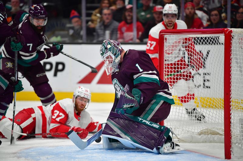 Jan 7, 2024; Anaheim, California, USA; Anaheim Ducks goaltender Lukas Dostal (1) blocks a shot against the Detroit Red Wings during the first period at Honda Center. Mandatory Credit: Gary A. Vasquez-USA TODAY Sports