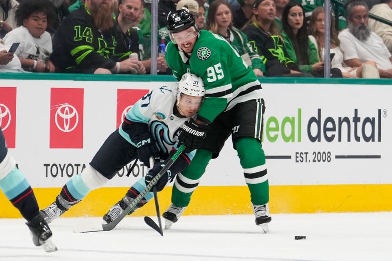 Oct 13, 2024; Dallas, Texas, USA; Dallas Stars center Matt Duchene (95) and Seattle Kraken center Yanni Gourde (37) battle for the puck during the second period at American Airlines Center. Mandatory Credit: Chris Jones-Imagn Images