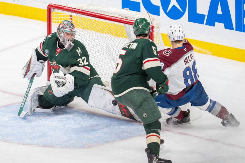 Mar 11, 2025; Saint Paul, Minnesota, USA; Minnesota Wild goaltender Filip Gustavsson (32) makes a pad save on Colorado Avalanche center Martin Necas (88) in the second period at Xcel Energy Center. Mandatory Credit: Matt Blewett-Imagn Images