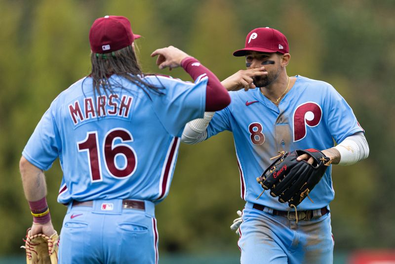 Apr 27, 2023; Philadelphia, Pennsylvania, USA; Philadelphia Phillies right fielder Nick Castellanos (8) celebrates with center fielder Brandon Marsh (16) after making a sliding catch to end the seventh inning against the Seattle Mariners at Citizens Bank Park. Mandatory Credit: Bill Streicher-USA TODAY Sports