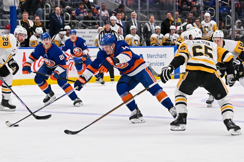 Apr 17, 2024; Elmont, New York, USA;  New York Islanders center Bo Horvat (14) skates between Pittsburgh Penguins defenseman Erik Karlsson (65) and defenseman Marcus Pettersson (28) during the second period at UBS Arena. Mandatory Credit: Dennis Schneidler-USA TODAY Sports