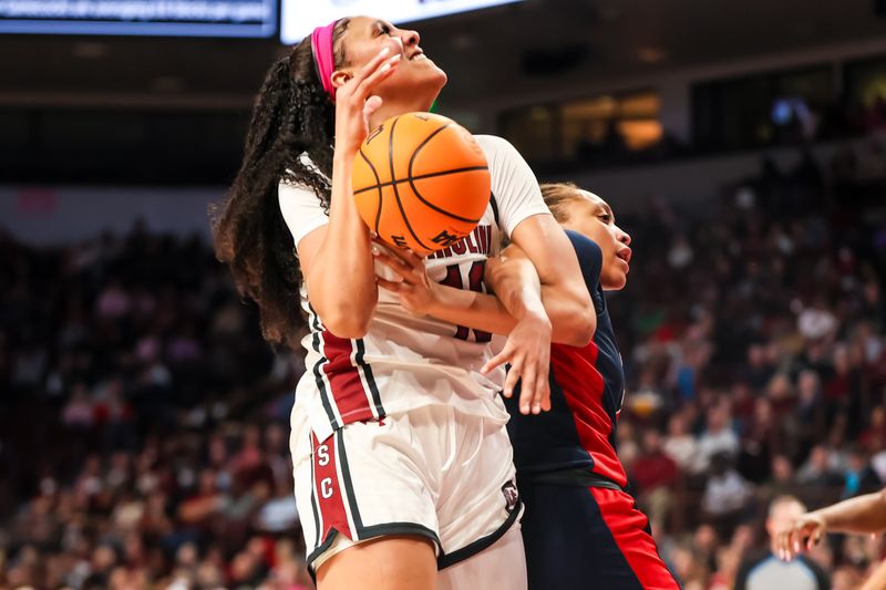 Feb 4, 2024; Columbia, South Carolina, USA; South Carolina Gamecocks center Kamilla Cardoso (10) gets tangled with Ole Miss Rebels forward Madison Scott (24) in the second half at Colonial Life Arena. Mandatory Credit: Jeff Blake-USA TODAY Sports