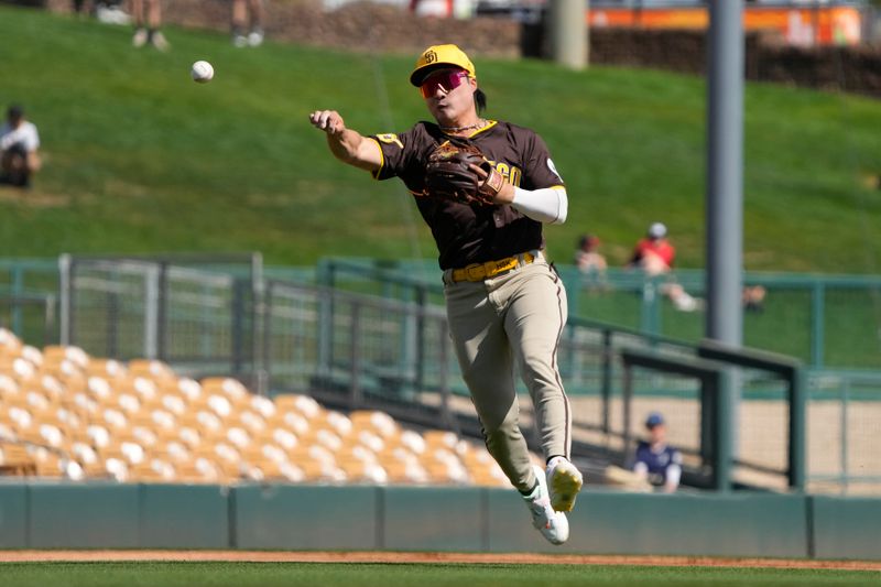 Feb 28, 2024; Phoenix, Arizona, USA; San Diego Padres shortstop Ha-Seong Kim (7) makes the play for an out against the Chicago White Sox in the first inning at Camelback Ranch-Glendale. Mandatory Credit: Rick Scuteri-USA TODAY Sports