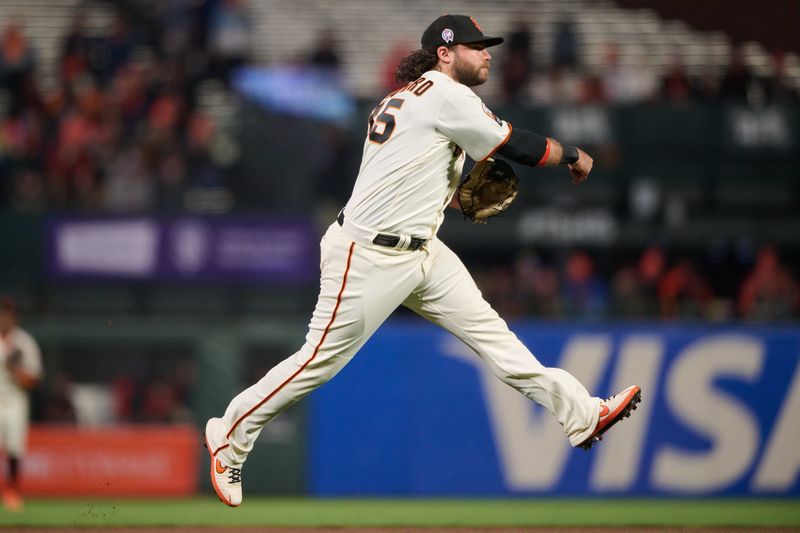 Sep 11, 2023; San Francisco, California, USA; San Francisco Giants infielder Brandon Crawford (35) leaps after throwing the ball to first base against the Cleveland Guardians during the fourth inning at Oracle Park. Mandatory Credit: Robert Edwards-USA TODAY Sports