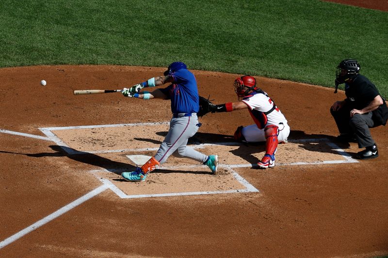 Apr 28, 2025; Washington, District of Columbia, USA; New York Mets catcher Francisco Alvarez (4) hits an RBI double against the Washington Nationals during the second inning at Nationals Park. Mandatory Credit: Geoff Burke-Imagn Images