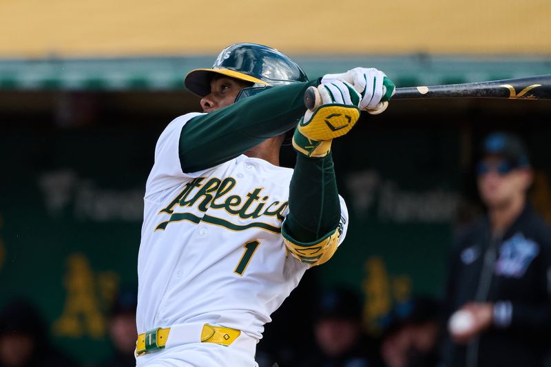 May 4, 2024; Oakland, California, USA; Oakland Athletics outfielder Esteury Ruiz (1) hits an RBI single against the Miami Marlins during the second inning at Oakland-Alameda County Coliseum. Mandatory Credit: Robert Edwards-USA TODAY Sports