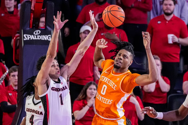 Jan 13, 2024; Athens, Georgia, USA; Georgia Bulldogs guard Jabri Abdur-Rahim (1) blocks the ball from Tennessee Volunteers forward Jonas Aidoo (0) during the second half at Stegeman Coliseum. Mandatory Credit: Dale Zanine-USA TODAY Sports