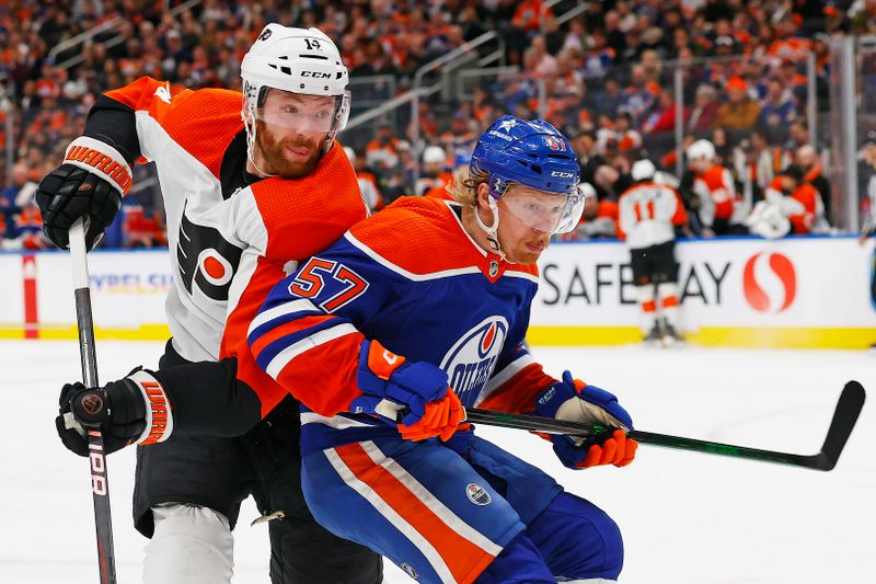 Jan 2, 2024; Edmonton, Alberta, CAN; Philadelphia Flyers forward Sean Couturier (14) and Edmonton Oilers forward James Hamblin (57) battle for position during the second period at Rogers Place. Mandatory Credit: Perry Nelson-USA TODAY Sports