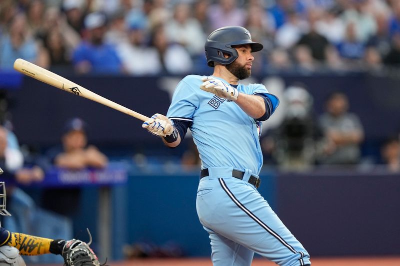 May 30, 2023; Toronto, Ontario, CAN; Toronto Blue Jays designated hitter Brandon Belt (13) hits an RBI single against the Milwaukee Brewers during the second inning at Rogers Centre. Mandatory Credit: John E. Sokolowski-USA TODAY Sports