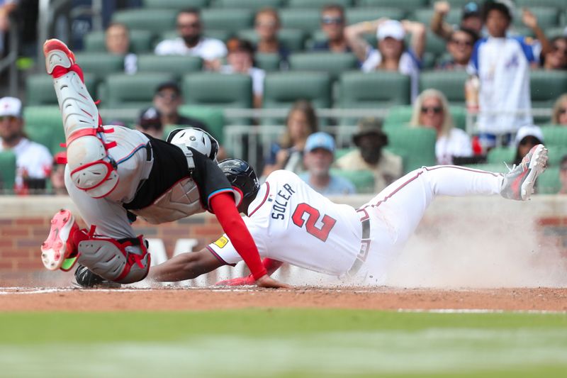 Aug 4, 2024; Cumberland, Georgia, USA; Atlanta Braves designated hitter Jorge Soler (2) is tagged out by Miami Marlins catcher Ali Sanchez (47) in the third inning at Truist Park. Mandatory Credit: Mady Mertens-USA TODAY Sports