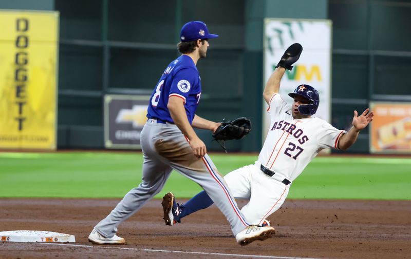 Apr 13, 2024; Houston, Texas, USA;  Houston Astros second base Jose Altuve (27) tags up against Texas Rangers third baseman Josh Smith (8) in the fourth inning at Minute Maid Park. Mandatory Credit: Thomas Shea-USA TODAY Sports