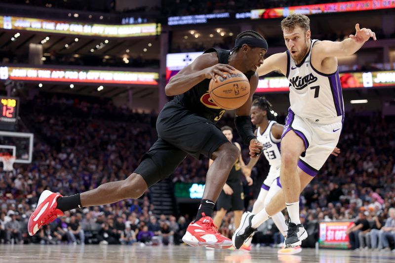 SACRAMENTO, CALIFORNIA - NOVEMBER 13: Caris LeVert #3 of the Cleveland Cavaliers is guarded by Sasha Vezenkov #7 of the Sacramento Kings in the second half at Golden 1 Center on November 13, 2023 in Sacramento, California. NOTE TO USER: User expressly acknowledges and agrees that, by downloading and or using this photograph, User is consenting to the terms and conditions of the Getty Images License Agreement.  (Photo by Ezra Shaw/Getty Images)