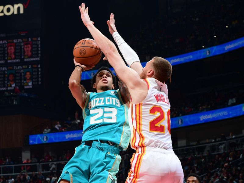 ATLANTA, GA - MARCH 23: Tre Mann #23 of the Charlotte Hornets drives to the basket during the game against the Atlanta Hawks on March 23, 2024 at State Farm Arena in Atlanta, Georgia.  NOTE TO USER: User expressly acknowledges and agrees that, by downloading and/or using this Photograph, user is consenting to the terms and conditions of the Getty Images License Agreement. Mandatory Copyright Notice: Copyright 2024 NBAE (Photo by Scott Cunningham/NBAE via Getty Images)