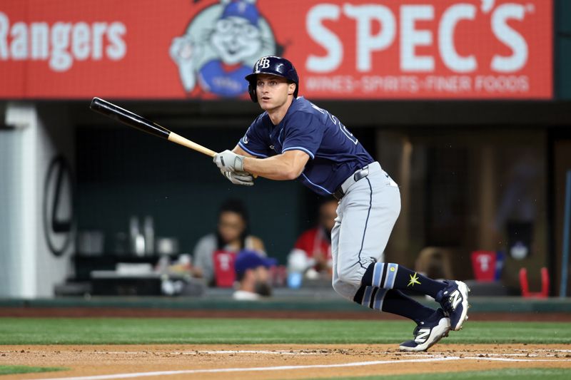 Apr 6, 2025; Arlington, Texas, USA; Tampa Bay Rays left fielder Jake Mangum (28) singles during the second inning against the Texas Rangers at Globe Life Field. Mandatory Credit: Tim Heitman-Imagn Images