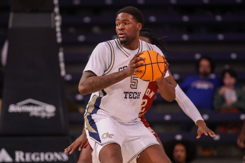 Jan 3, 2026; Atlanta, Georgia, USA; Georgia Tech Yellow Jackets center Peyton Marshall (5) handles the ball against the Boston College Eagles in the first half at McCamish Pavilion. Mandatory Credit: Brett Davis-Imagn Images