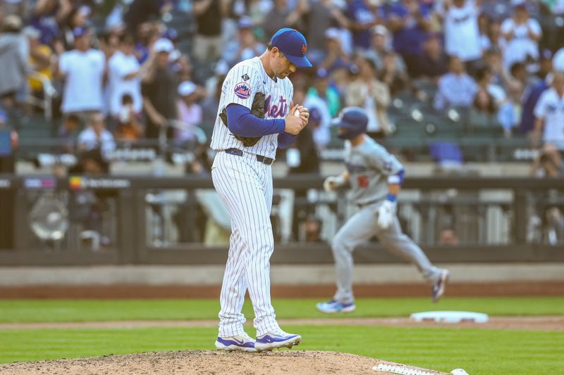 May 29, 2024; New York City, New York, USA;  New York Mets relief pitcher Adam Ottavino (0) reacts after giving up a home run to Los Angeles Dodgers catcher Will Smith (16) in the eighth inning at Citi Field. Mandatory Credit: Wendell Cruz-USA TODAY Sports