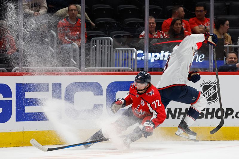 Sep 27, 2024; Washington, District of Columbia, USA; Columbus Blue Jackets defenseman Zach Werenski (8) skates with the puck past Washington Capitals forward Pierrick Dube (72) in the first period at Capital One Arena. Mandatory Credit: Geoff Burke-Imagn Images