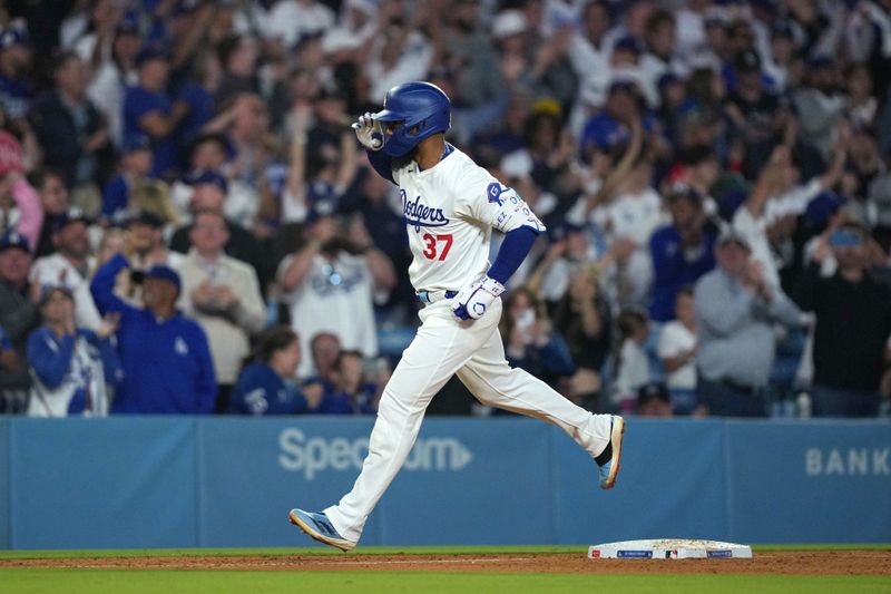 Jun 11, 2024; Los Angeles, California, USA; Los Angeles Dodgers left fielder Teoscar Hernandez (37) runs the bases after hitting a two-run home run in the sixth inning against the Texas Rangers at Dodger Stadium. Mandatory Credit: Kirby Lee-USA TODAY Sports