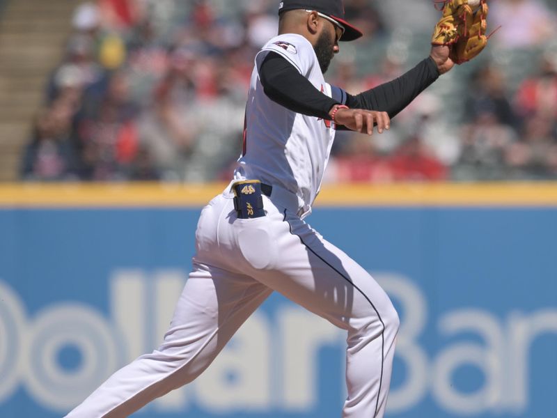 Apr 9, 2023; Cleveland, Ohio, USA; Cleveland Guardians shortstop Amed Rosario (1) leaps for the throw as Seattle Mariners designated hitter Teoscar Hernandez (35) steals second during the sixth inning at Progressive Field. Mandatory Credit: Ken Blaze-USA TODAY Sports