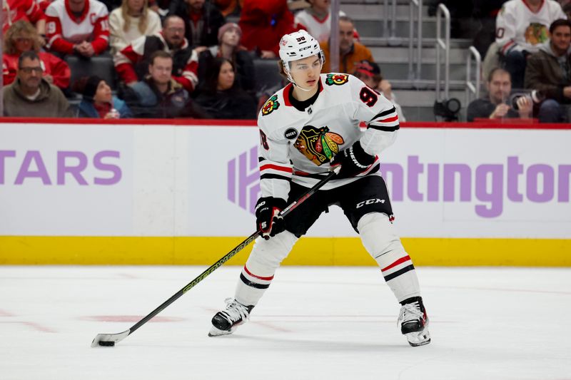 Nov 30, 2023; Detroit, Michigan, USA; Chicago Blackhawks center Connor Bedard (98) skates with the puck in the second period against the Detroit Red Wings at Little Caesars Arena. Mandatory Credit: Rick Osentoski-USA TODAY Sports