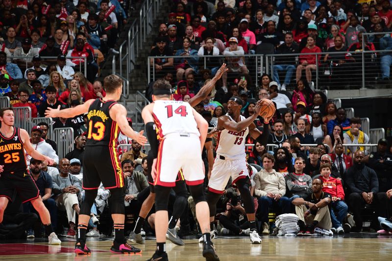 ATLANTA, GA - APRIL 9: Bam Adebayo #13 of the Miami Heat handles the ball during the game against the Atlanta Hawks on April 9, 2024 at State Farm Arena in Atlanta, Georgia.  NOTE TO USER: User expressly acknowledges and agrees that, by downloading and/or using this Photograph, user is consenting to the terms and conditions of the Getty Images License Agreement. Mandatory Copyright Notice: Copyright 2024 NBAE (Photo by Scott Cunningham/NBAE via Getty Images)