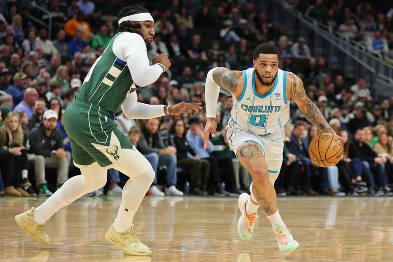 MILWAUKEE, WISCONSIN - FEBRUARY 09: Miles Bridges #0 of the Charlotte Hornets drives around Jae Crowder #99 of the Milwaukee Bucks during a game at Fiserv Forum on February 09, 2024 in Milwaukee, Wisconsin. NOTE TO USER: User expressly acknowledges and agrees that, by downloading and or using this photograph, User is consenting to the terms and conditions of the Getty Images License Agreement. (Photo by Stacy Revere/Getty Images)