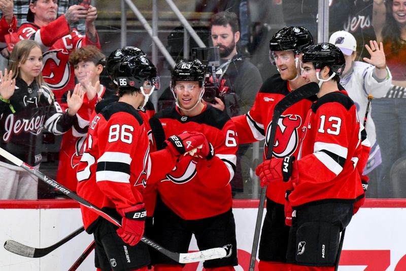 Oct 18, 2025; Newark, New Jersey, USA; New Jersey Devils left wing Jesper Bratt (63) celebrates with teammates after scoring a goal against the Edmonton Oilers during the second period at Prudential Center. Mandatory Credit: John Jones-Imagn Images