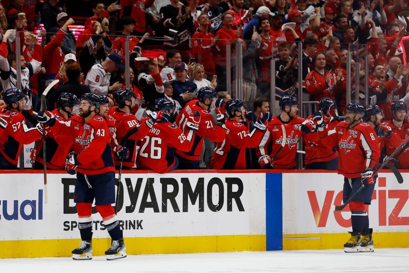 Apr 30, 2025; Washington, District of Columbia, USA; Washington Capitals right wing Tom Wilson (43) celebrates with teammates after scoring a goal against the Montreal Canadiens in the second period in game five of the first round of the 2025 Stanley Cup Playoffs at Capital One Arena. Mandatory Credit: Geoff Burke-Imagn Images