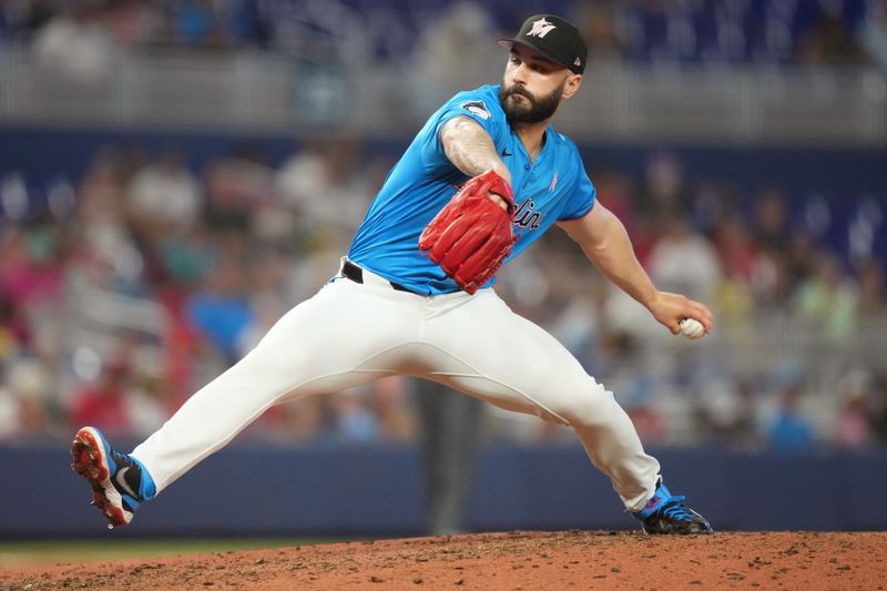 May 12, 2024; Miami, Florida, USA;  Miami Marlins pitcher Tanner Scott (66) pitches against the Philadelphia Phillies in the seventh inning at loanDepot Park. Mandatory Credit: Jim Rassol-USA TODAY Sports