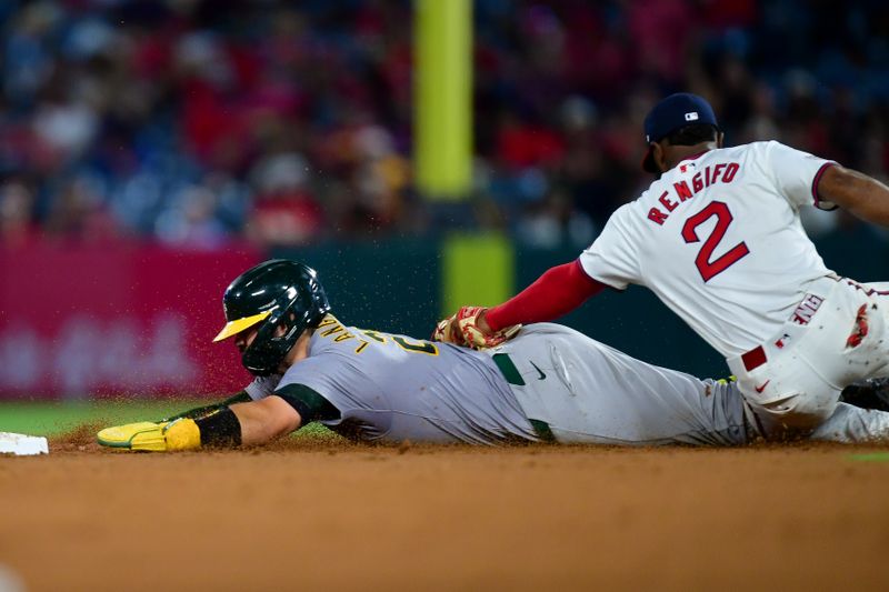 Jul 26, 2024; Anaheim, California, USA; Oakland Athletics catcher Shea Langeliers (23) is caught stealing second against Los Angeles Angels second baseman Luis Rengifo (2) during the eighth inning at Angel Stadium. Mandatory Credit: Gary A. Vasquez-USA TODAY Sports