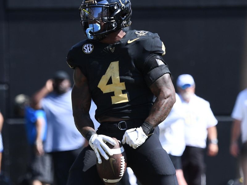 Sep 23, 2023; Nashville, Tennessee, USA; Vanderbilt Commodores running back Patrick Smith (4) celebrates after a touchdown against the Kentucky Wildcats during the second half at FirstBank Stadium. Mandatory Credit: Christopher Hanewinckel-USA TODAY Sports