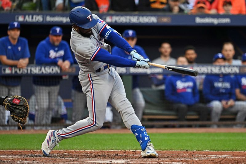 Oct 8, 2023; Baltimore, Maryland, USA; Texas Rangers right fielder Adolis Garcia (53) hits an RBI single during the second inning against the Baltimore Orioles during game two of the ALDS for the 2023 MLB playoffs at Oriole Park at Camden Yards. Mandatory Credit: Tommy Gilligan-USA TODAY Sports