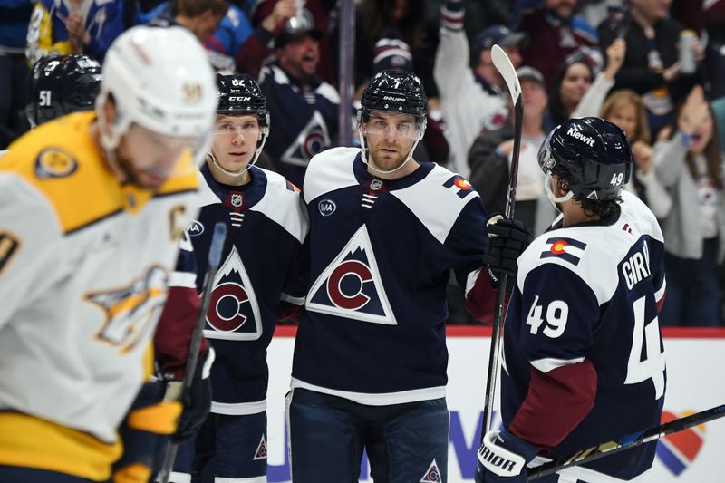 Nov 11, 2024; Denver, Colorado, USA; Colorado Avalanche defenseman Devon Toews (7) celebrates with teammates after a goal during the second period against the Nashville Predators at Ball Arena. Mandatory Credit: Christopher Hanewinckel-Imagn Images